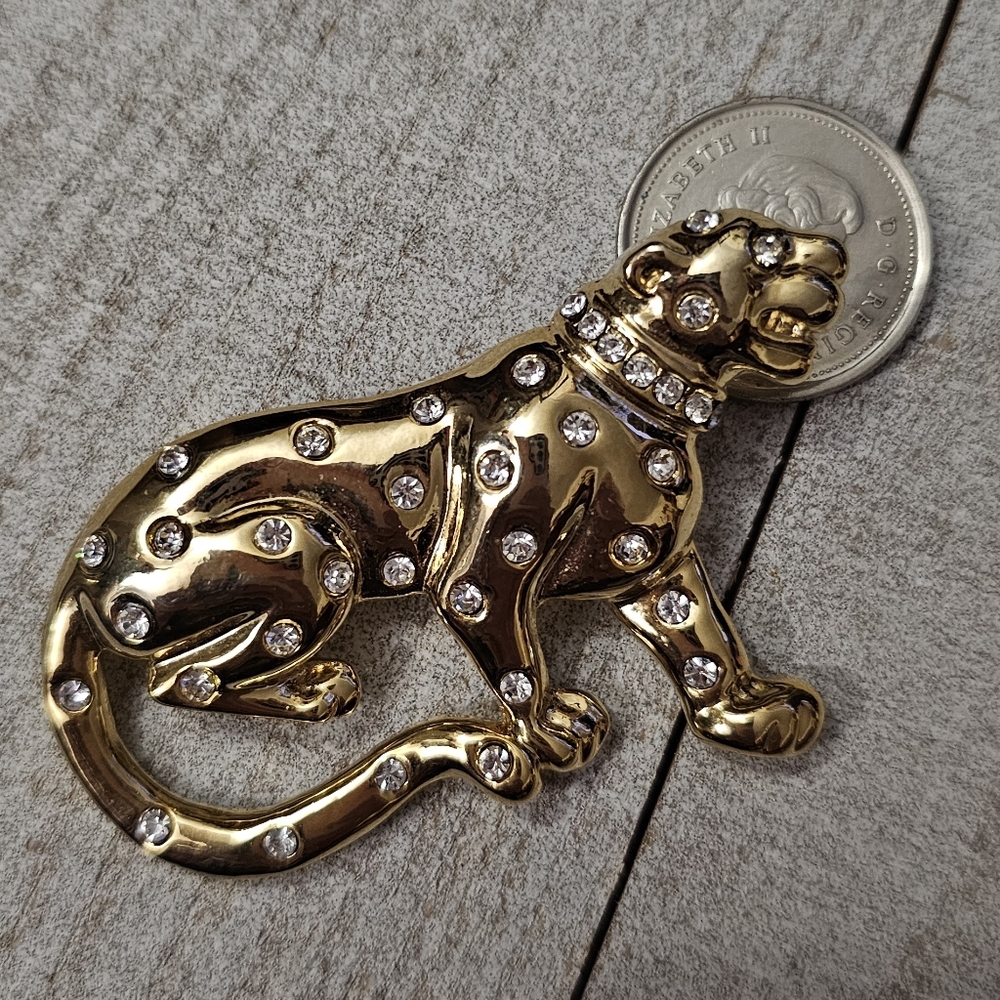 Gold and rhinestone leopard brooch. Costume jewelry. Brooch